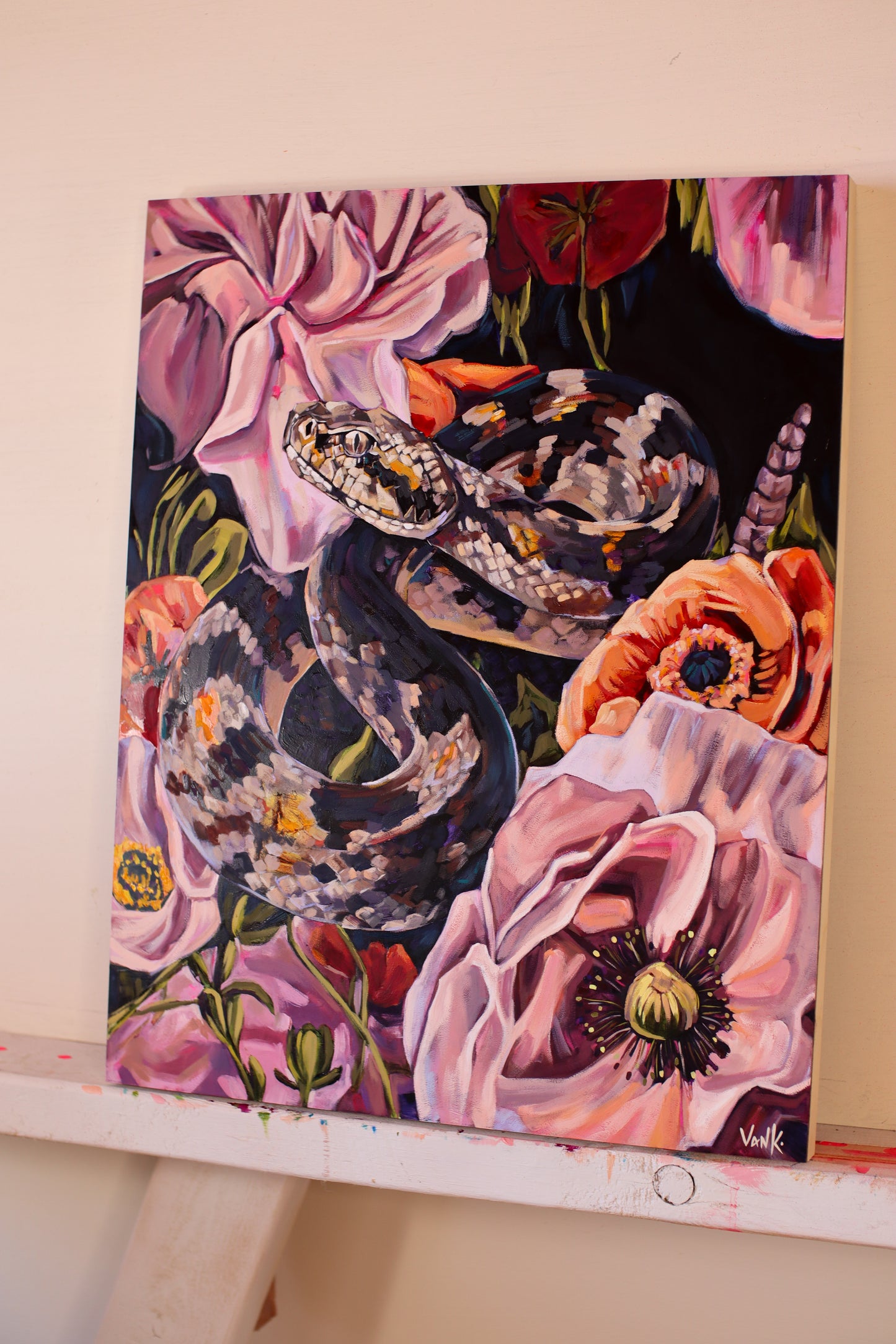 "the serpent wears a crown made of flowers"