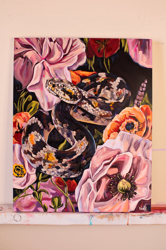 "the serpent wears a crown made of flowers"