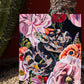 "the serpent wears a crown made of flowers"